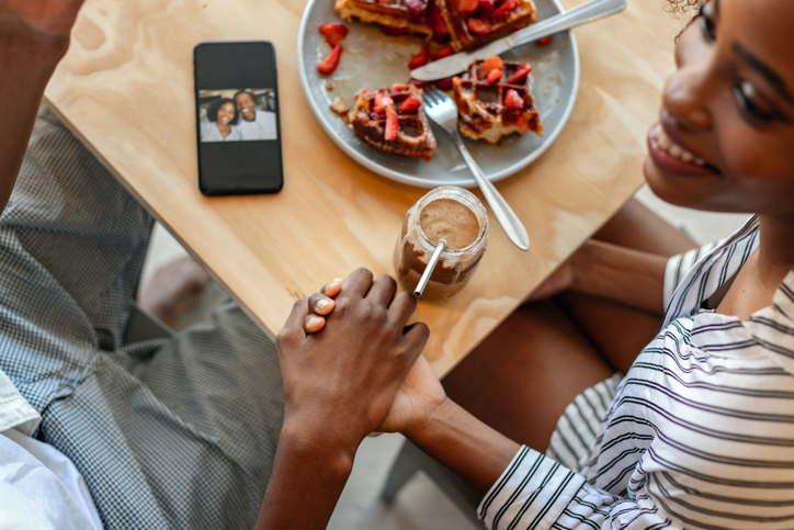 Couple In Cafe Eating Fruit Cake