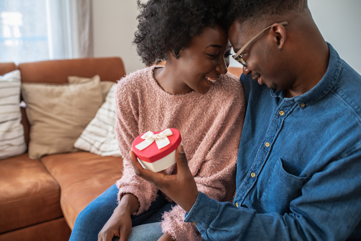 Romantic man giving a love present to his girlfriend