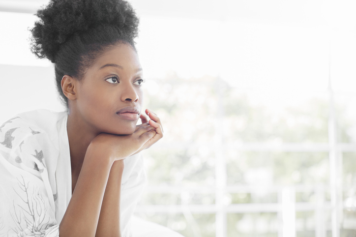 Beauty portrait of woman in bedroom