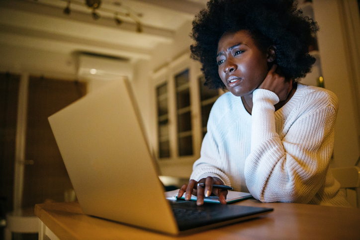 Woman works from home late at night