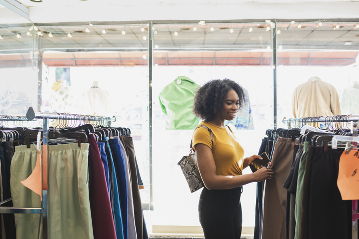 Young woman shopping in clothing store