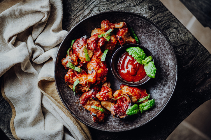 Vegan Buffalo Wings Made of Cauliflower Florets with BBQ-Sauce