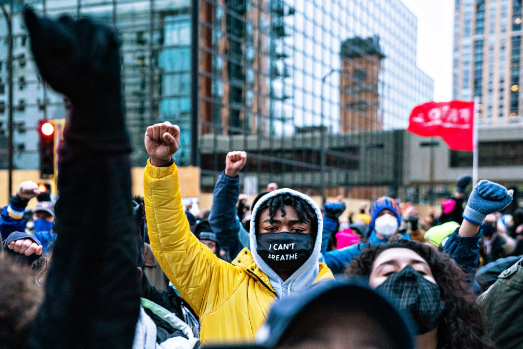 Protesters march around downtown Minneapolis near the courthouse calling for justice for George Flyod after closing arguments in the Chauvin trial has ended