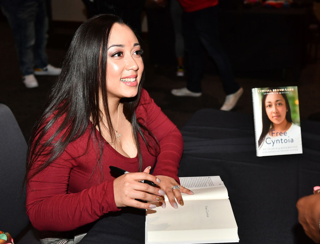 Cyntoia Brown Long Signs Copies Of "Free Cyntoia"