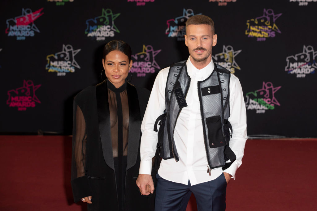 Christina Milian and Matt Pokora on the red carpet before the 2019 NRJ Music Awards ceremony.