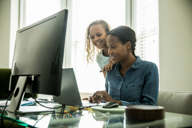 Mother working from home and talking with daughter