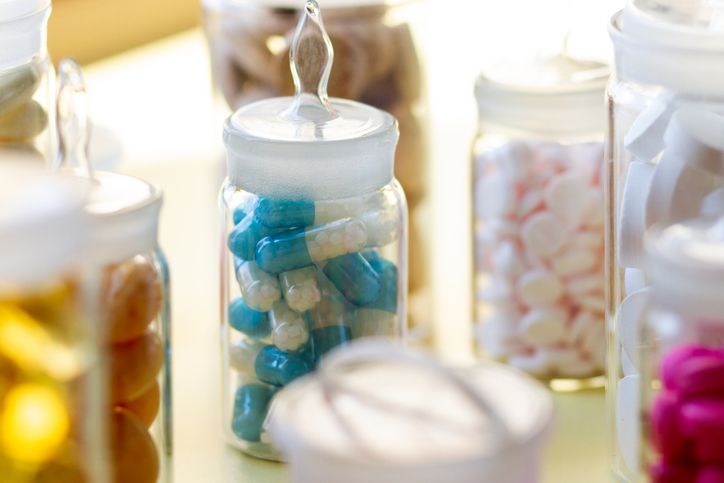 Pills in glass containers with caps